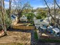 Aerial view from rear alley (Units A & B on the left, Unit C with separate fenced yard on the right)
