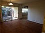 The large dining area with sliding glass door to the patio in unit A.