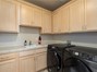 Laundry Room With Sink & Cabinets