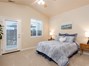 Master bedroom with private access to back patio & yard