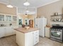 Spacious kitchen with large butcher block island and open to breakfast room